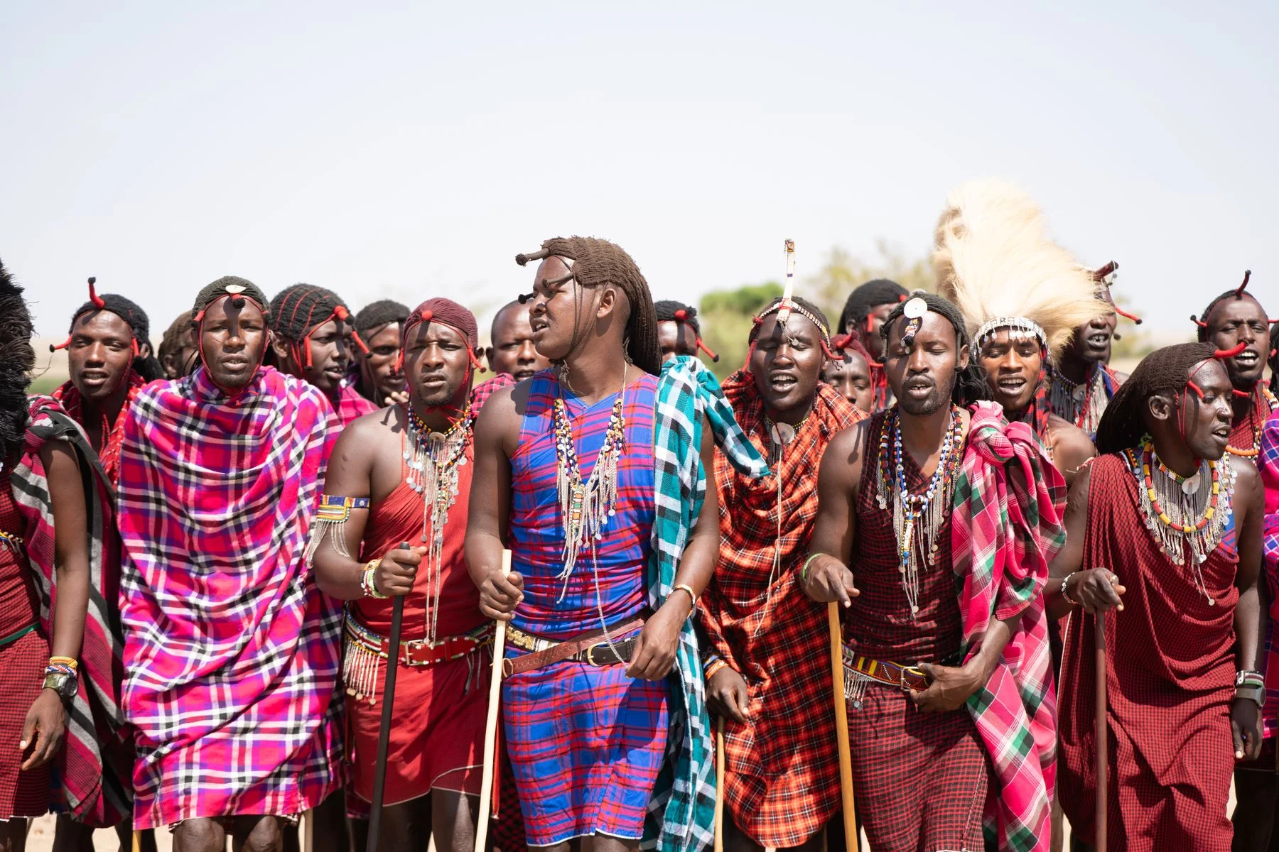 Maasai community celebrating outdoors in Kenya; illustrative licensed photograph